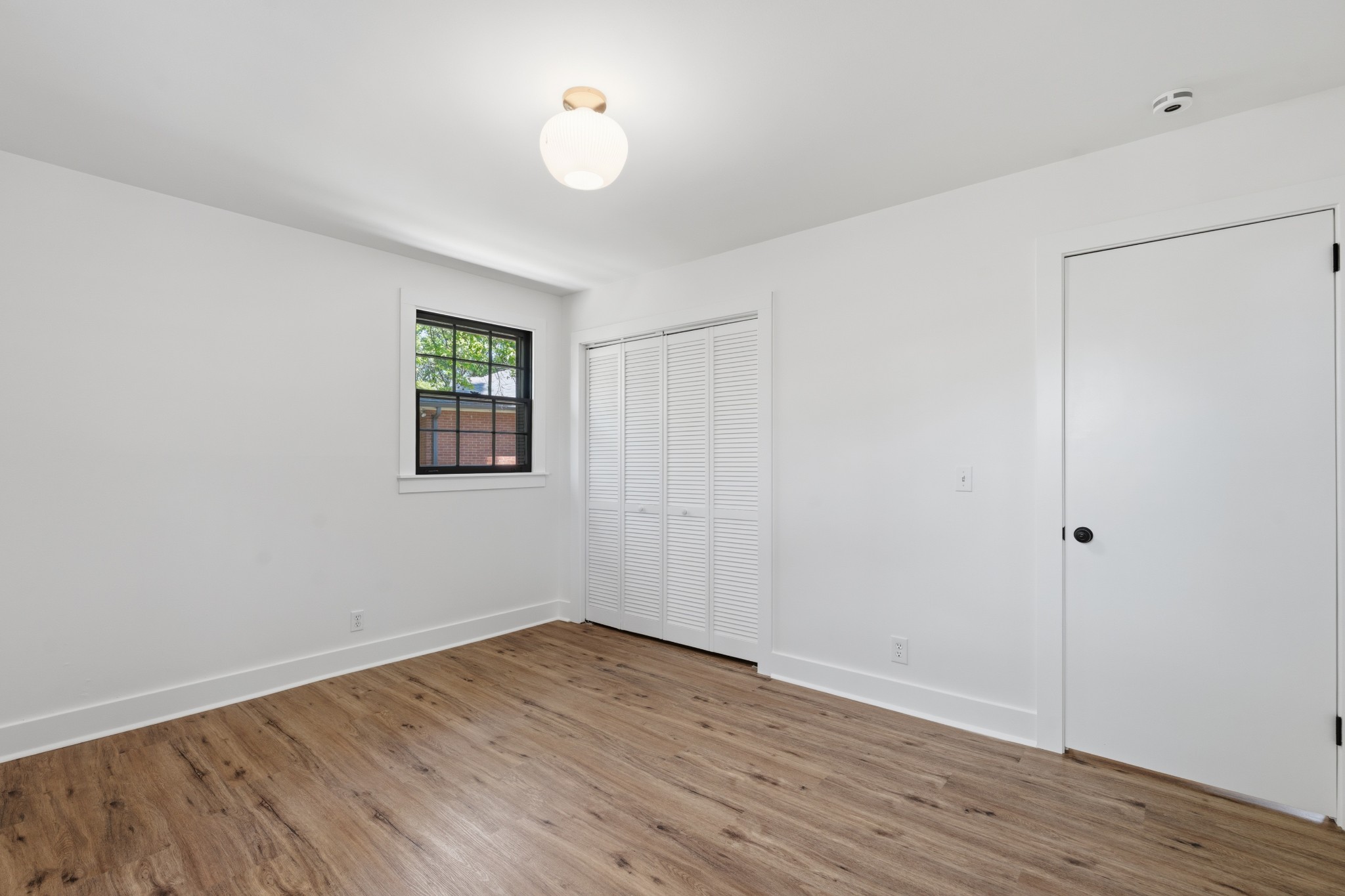 616 Baton Rouge Court Hermitage, TN 37076 - Photo 25 of 43 a view of a room with wooden floor and window