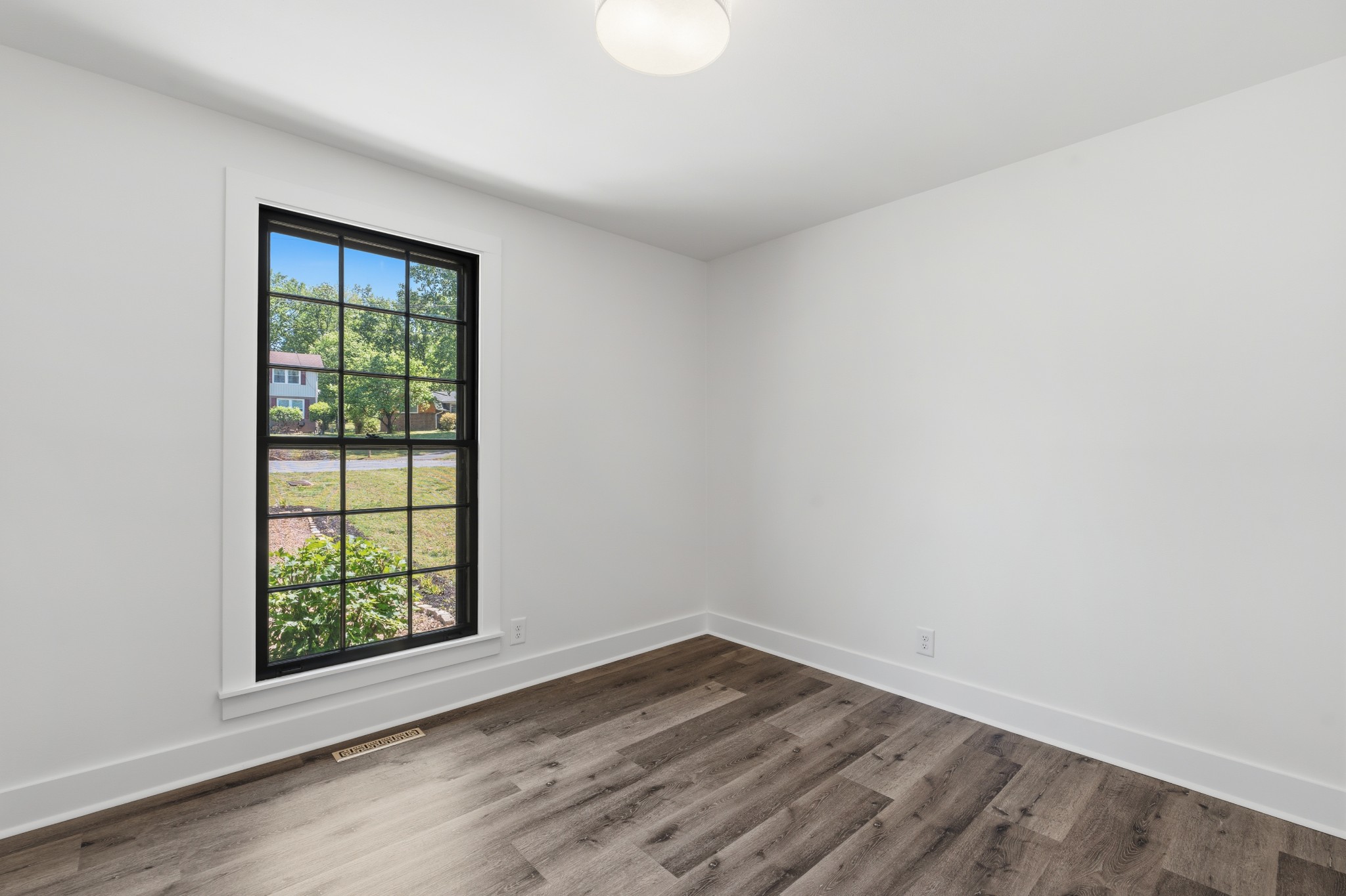 616 Baton Rouge Court Hermitage, TN 37076 - Photo 29 of 43 an empty room with wooden floor and windows