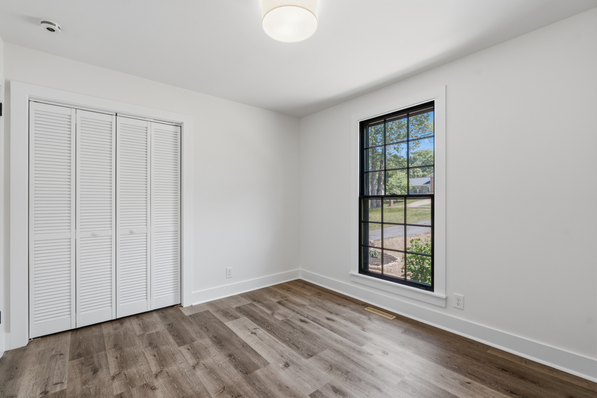 616 Baton Rouge Court Hermitage, TN 37076 - Photo 30 of 43 an empty room with wooden floor and windows