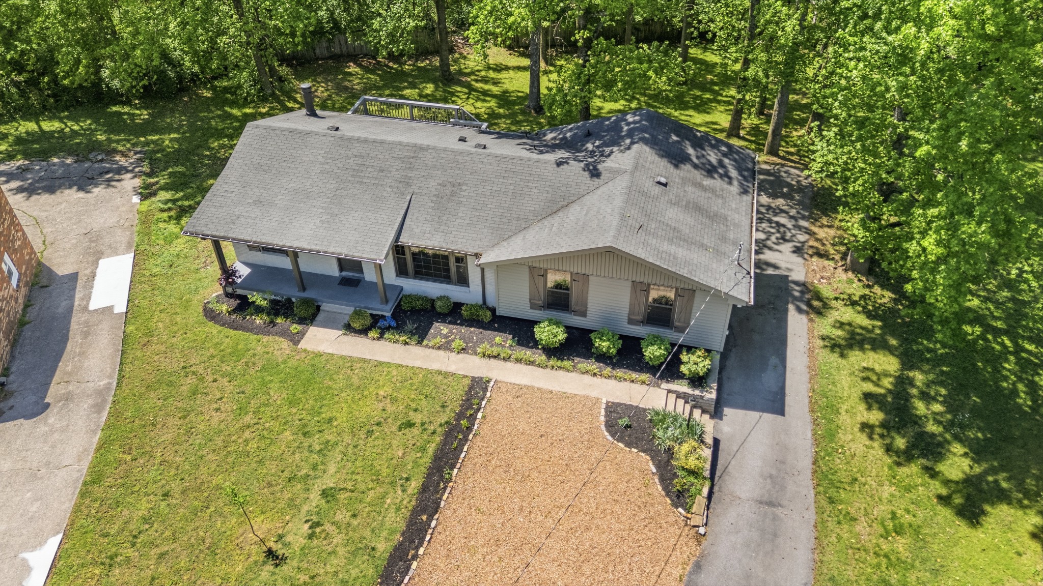616 Baton Rouge Court Hermitage, TN 37076 - Photo 3 of 43 a aerial view of a house with a yard table and chairs