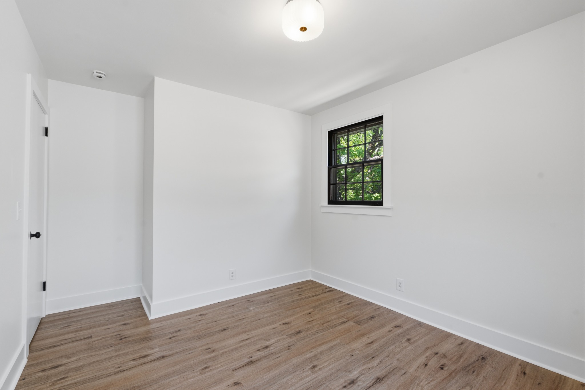 616 Baton Rouge Court Hermitage, TN 37076 - Photo 33 of 43 a view of an empty room with wooden floor and a window