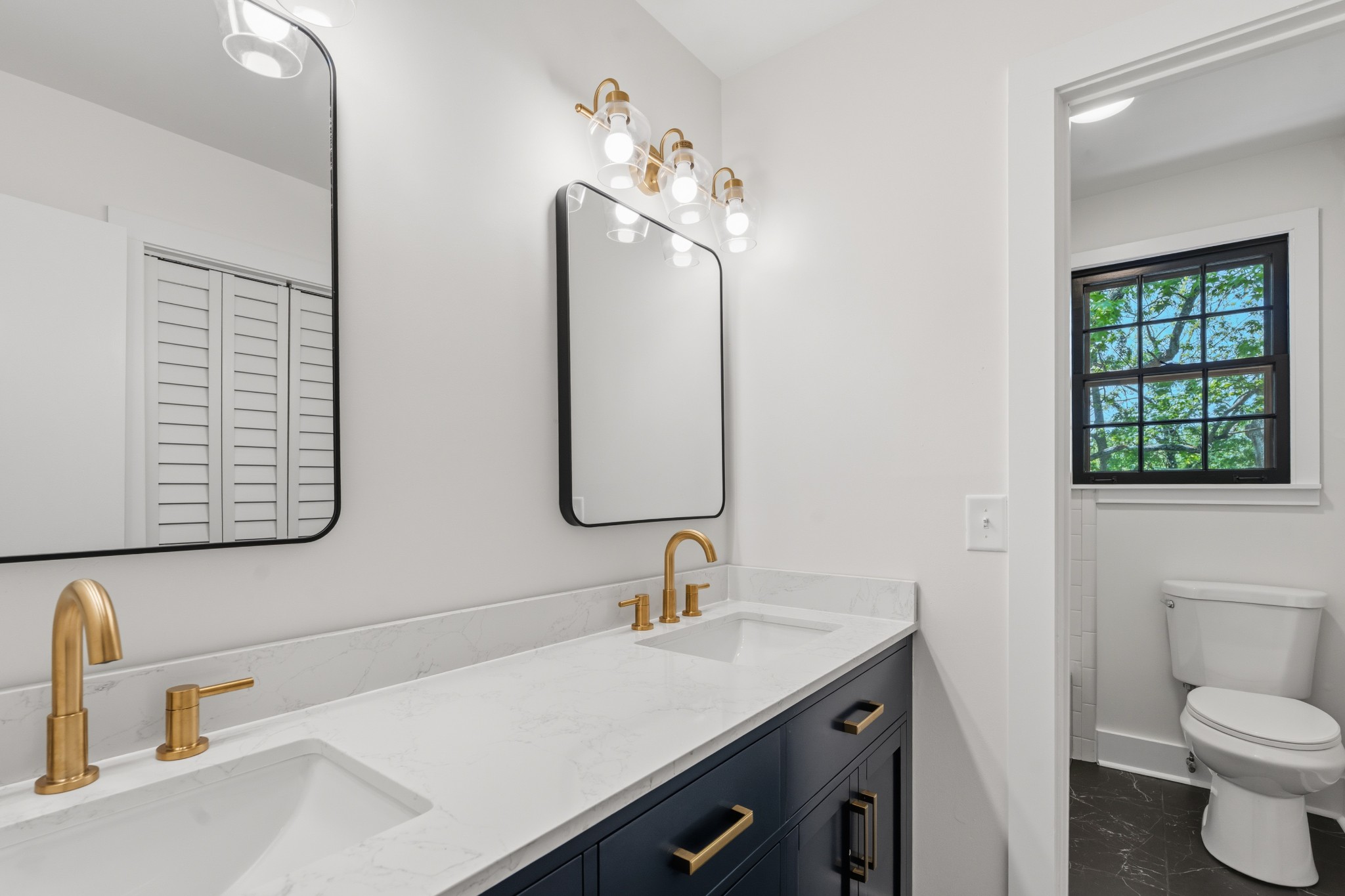 616 Baton Rouge Court Hermitage, TN 37076 - Photo 34 of 43 a bathroom with a sink a toilet and mirror