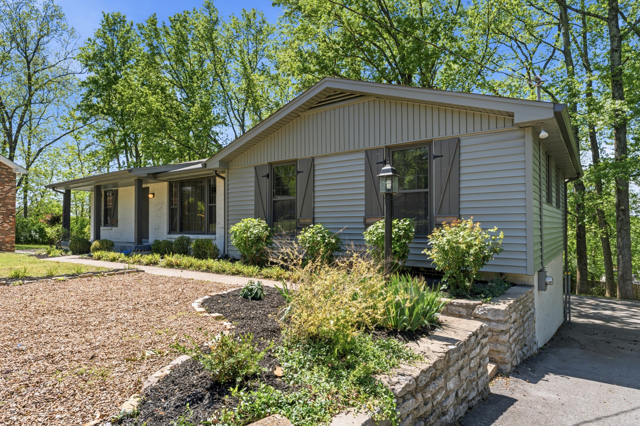616 Baton Rouge Court Hermitage, TN 37076 - Photo 4 of 43 a front view of a house with a yard and potted plants