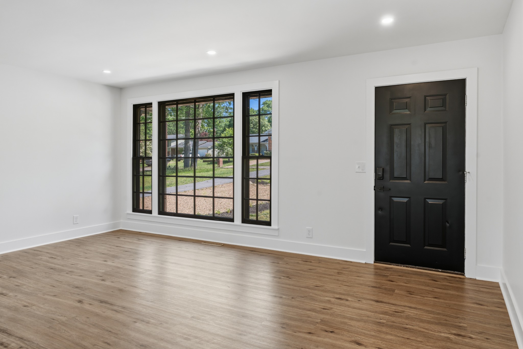 616 Baton Rouge Court Hermitage, TN 37076 - Photo 7 of 43 a view of an empty room with wooden floor and a window