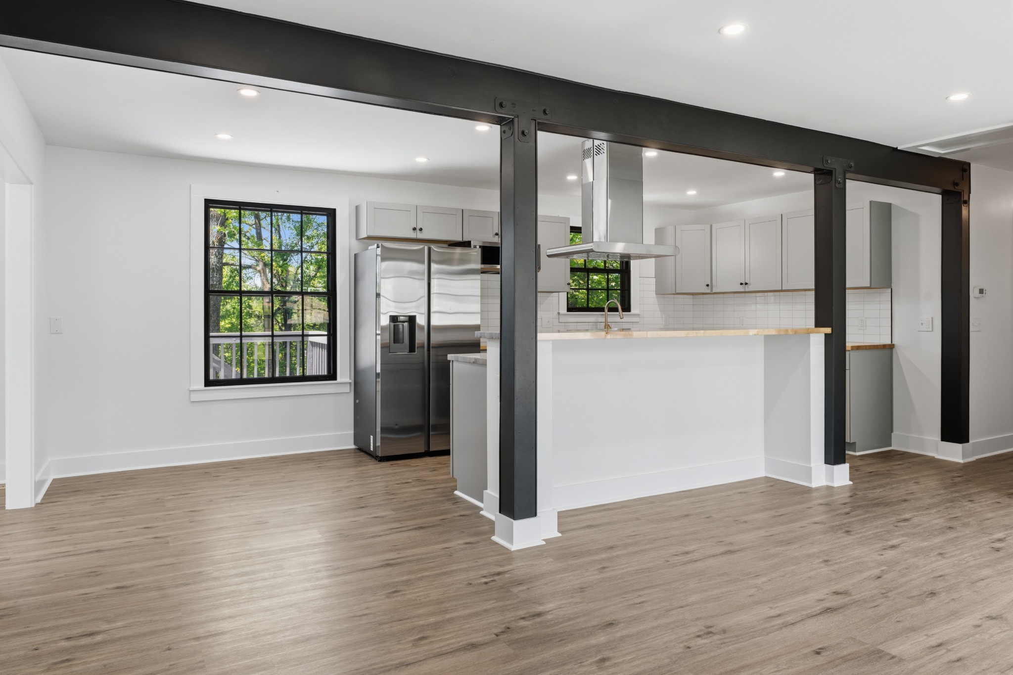 616 Baton Rouge Court Hermitage, TN 37076 - Photo 10 of 43 a view of a kitchen with wooden floor and a refrigerator