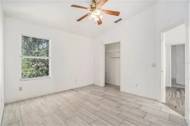 a view of an empty room with a window