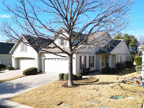a view of a house with snow in the background