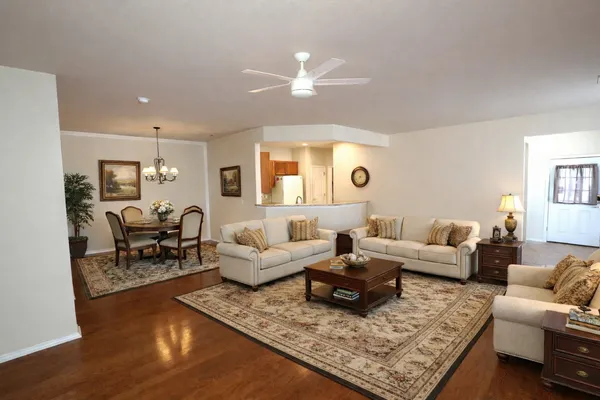 a view of dining room with furniture and a refrigerator