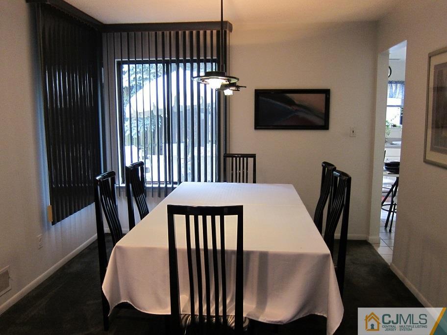 49 Park Gate Drive Edison, NJ 08820 - Photo 5 of 17 a view of a dining room with furniture window and wooden floor