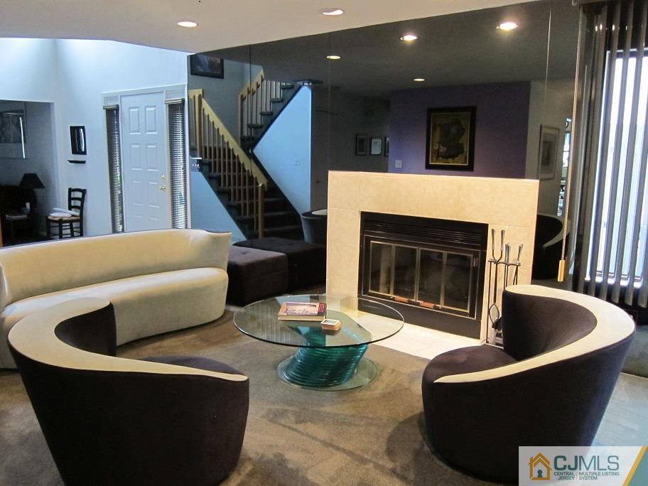 49 Park Gate Drive Edison, NJ 08820 - Photo 6 of 17 a living room with furniture and a fireplace