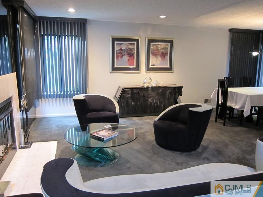 49 Park Gate Drive Edison, NJ 08820 - Photo 7 of 17 a living room with furniture and a fireplace