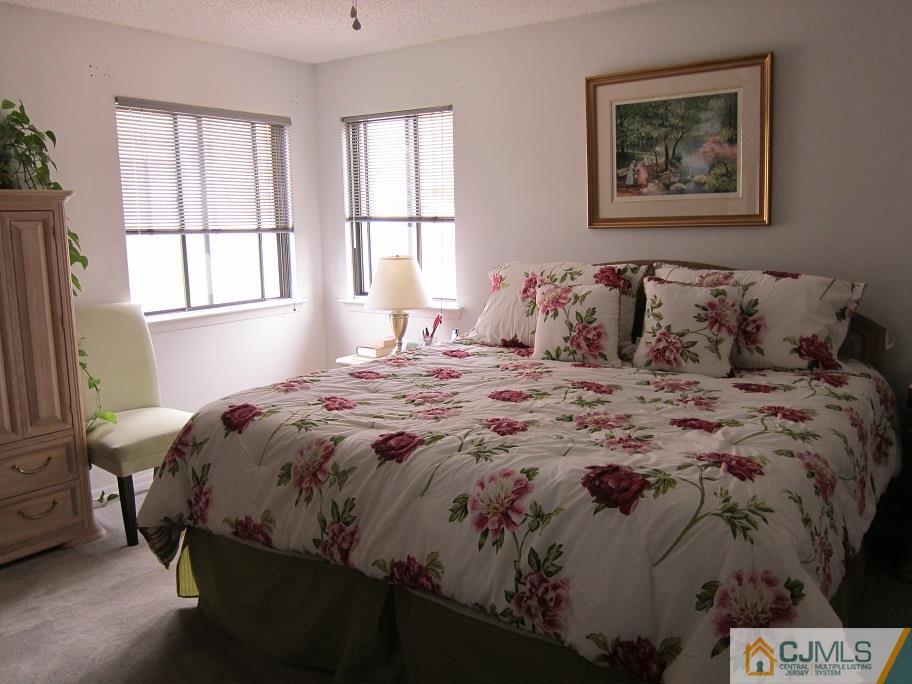 49 Park Gate Drive Edison, NJ 08820 - Photo 10 of 17 a bedroom with a bed and a window