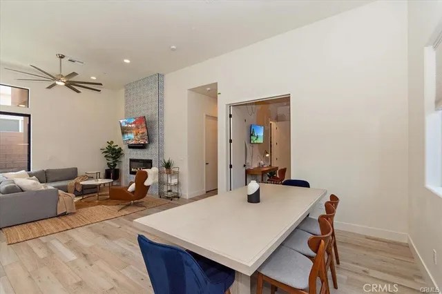 a view of a dining room with furniture and a chandelier