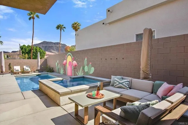 a living room with furniture and a table
