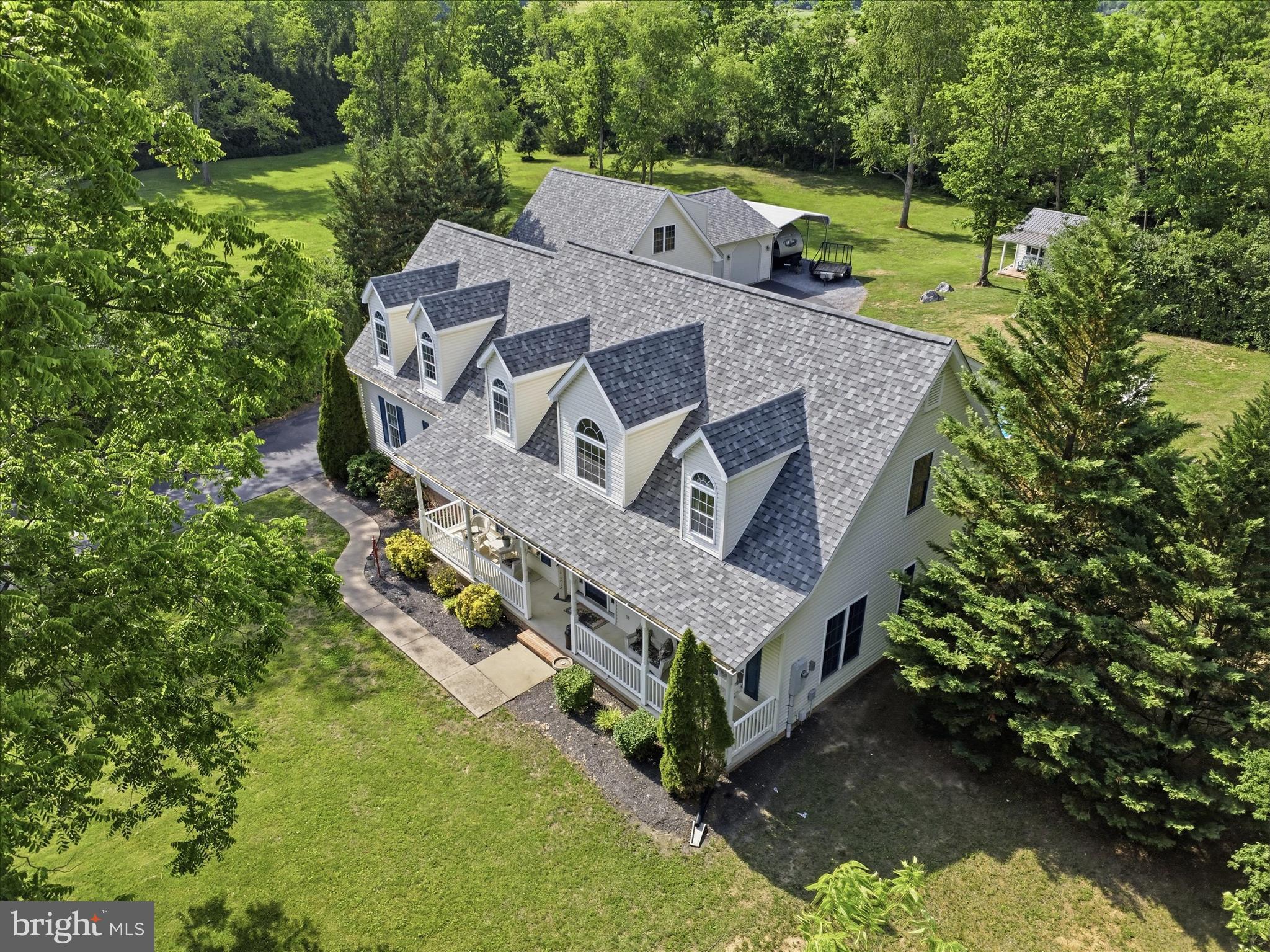 726 Doe Run Road Inwood, WV 25428 - Photo 5 of 68 an aerial view of a house with a big yard