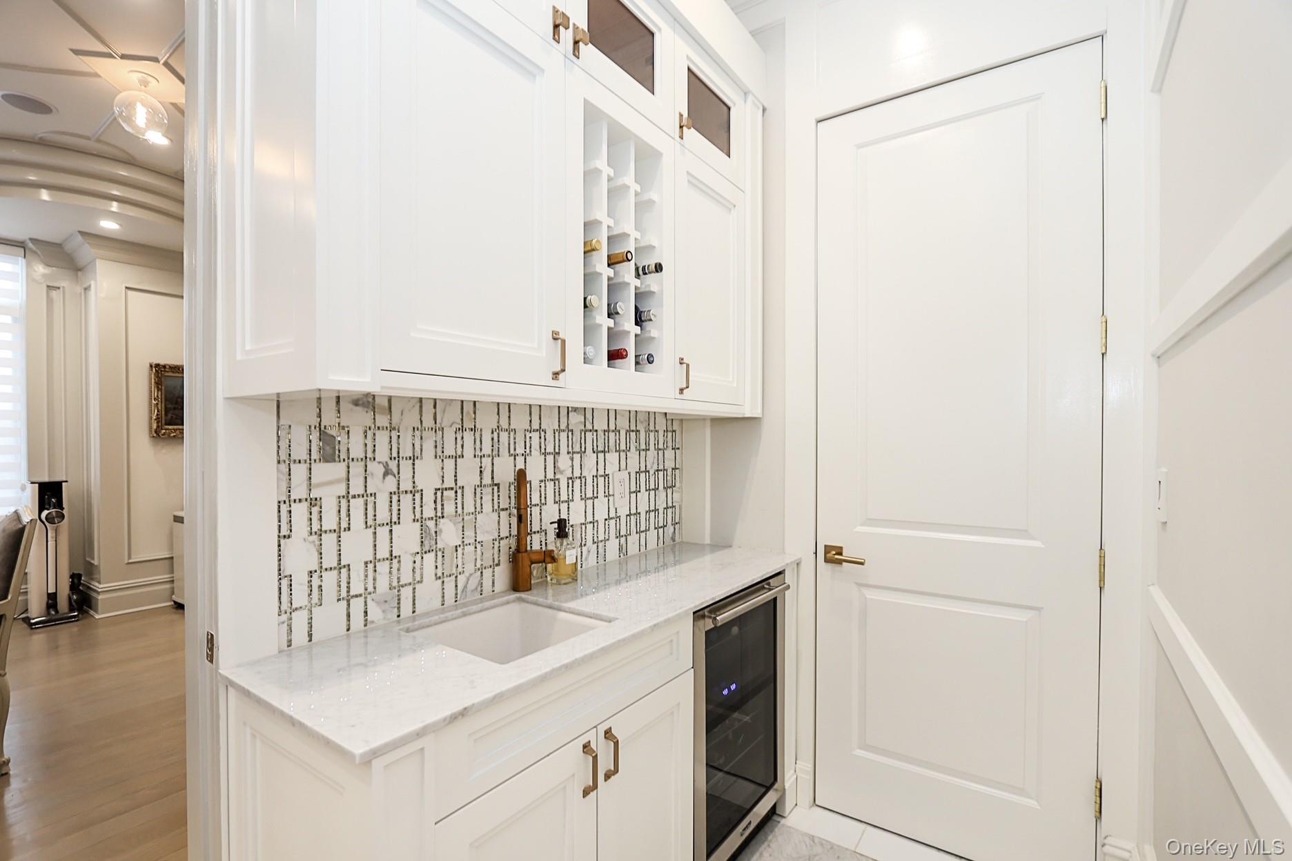 19 Gilbert Road Great Neck, NY 11024 - Photo 13 of 36 a bathroom with a sink and a mirror