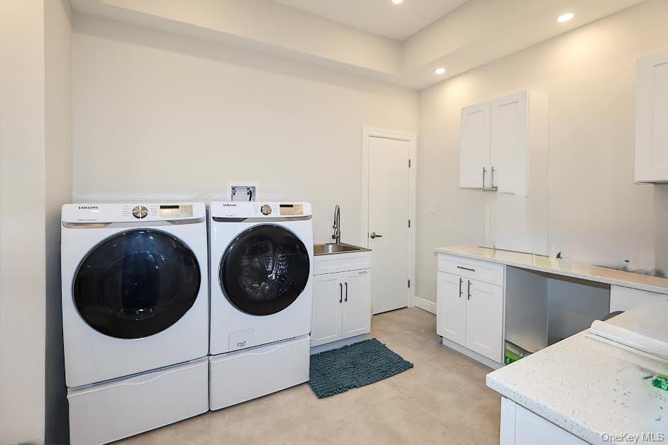 19 Gilbert Road Great Neck, NY 11024 - Photo 29 of 36 a utility room with sink dryer and washer
