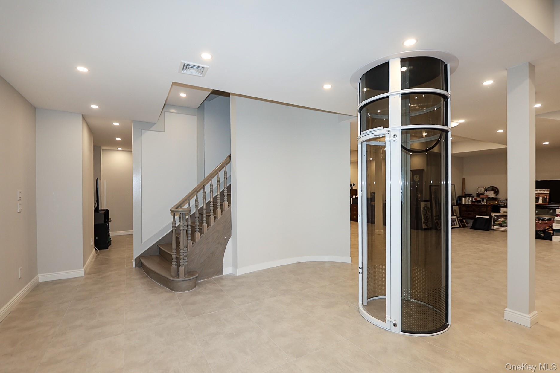 19 Gilbert Road Great Neck, NY 11024 - Photo 31 of 36 a view of a hallway with a livingroom and entryway