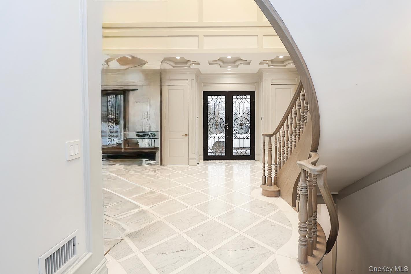 19 Gilbert Road Great Neck, NY 11024 - Photo 4 of 36 a view of a bedroom with entryway and stairs