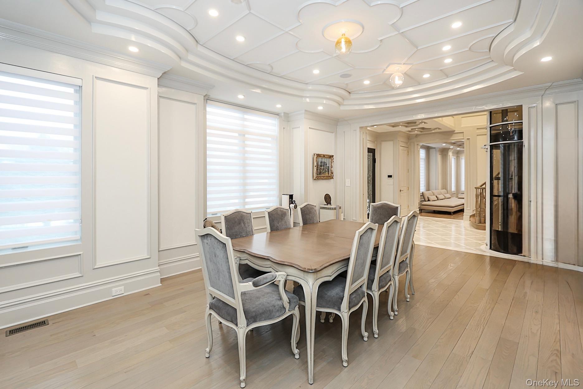 19 Gilbert Road Great Neck, NY 11024 - Photo 8 of 36 a view of a a dining room with furniture window and wooden floor