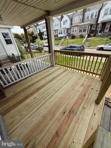 a view of balcony with wooden floor