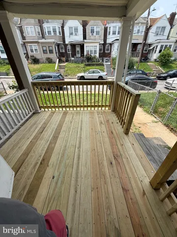 a view of balcony with furniture and wooden floor