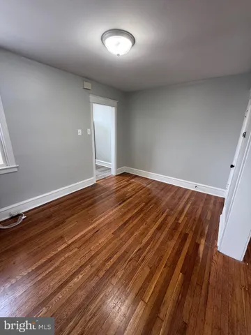 a view of room with wooden floor