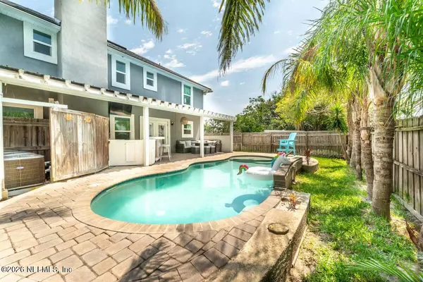 a view of a swimming pool with a patio