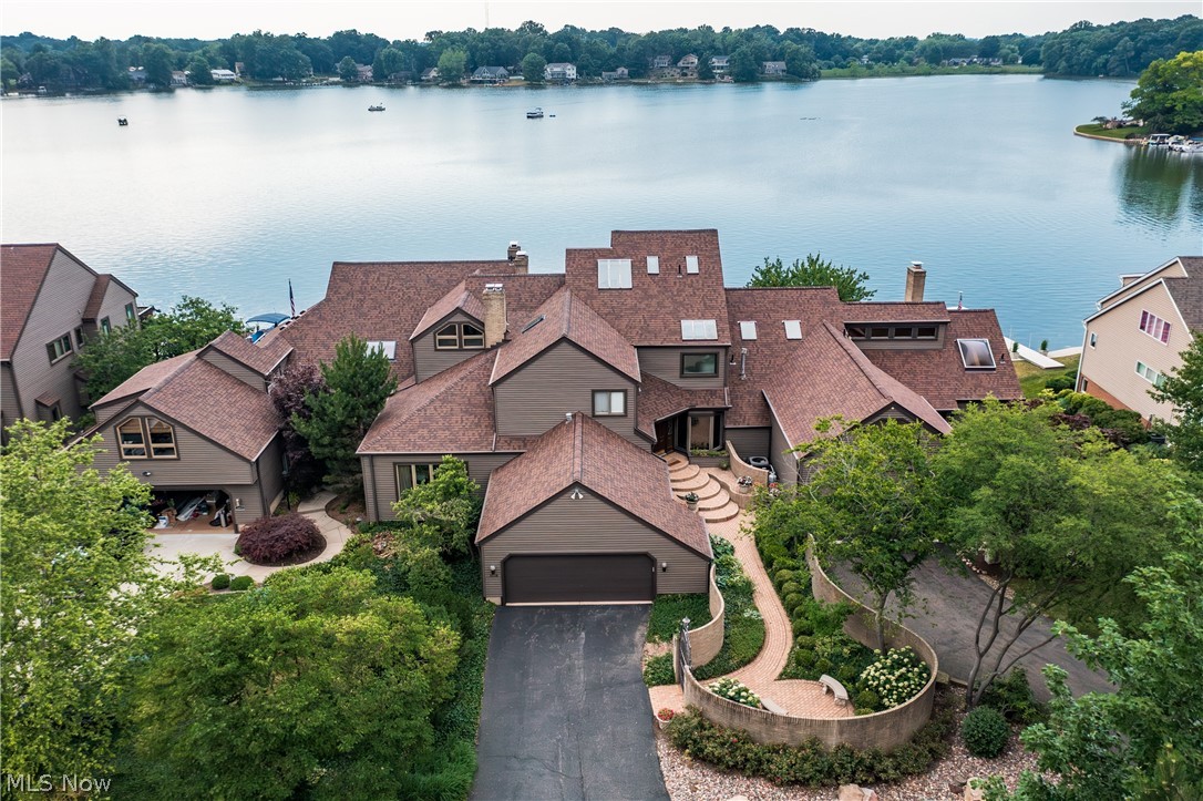 1415 Harbor Drive Northwest Canton, OH 44708 - Photo 1 of 46 Drone / aerial view front view of the house featuring a water view
