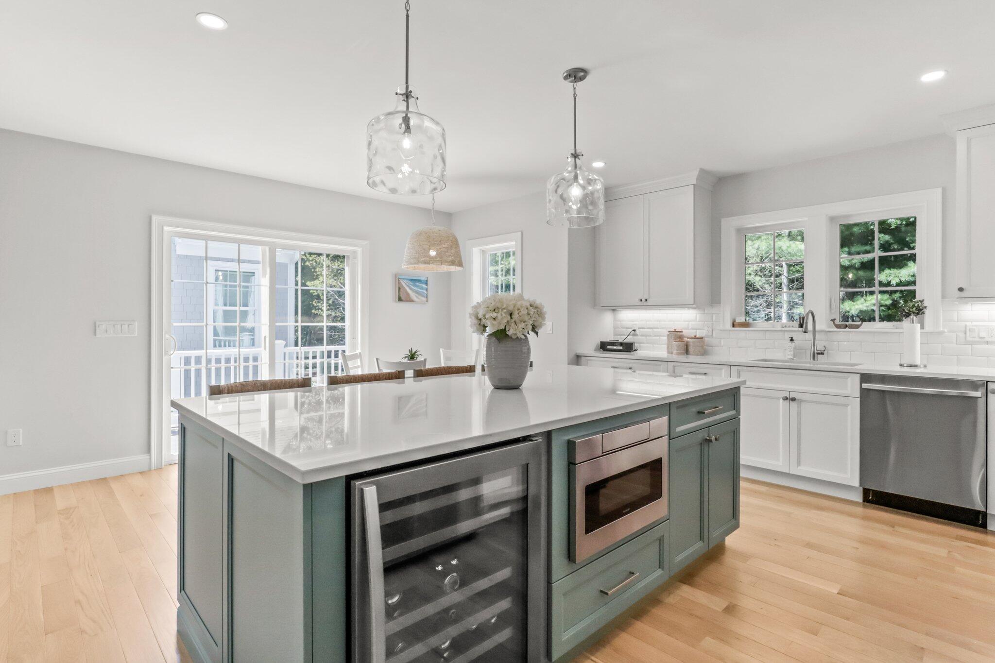 58 Cobblestone Circle Mashpee, MA 02649 - Photo 12 of 49 a kitchen with a sink and stove