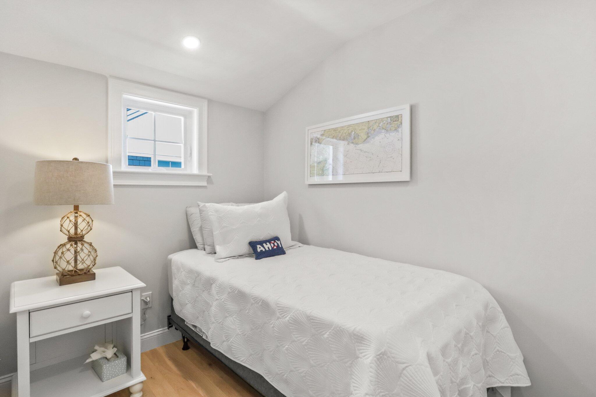 58 Cobblestone Circle Mashpee, MA 02649 - Photo 27 of 49 a bedroom with a bed and a table