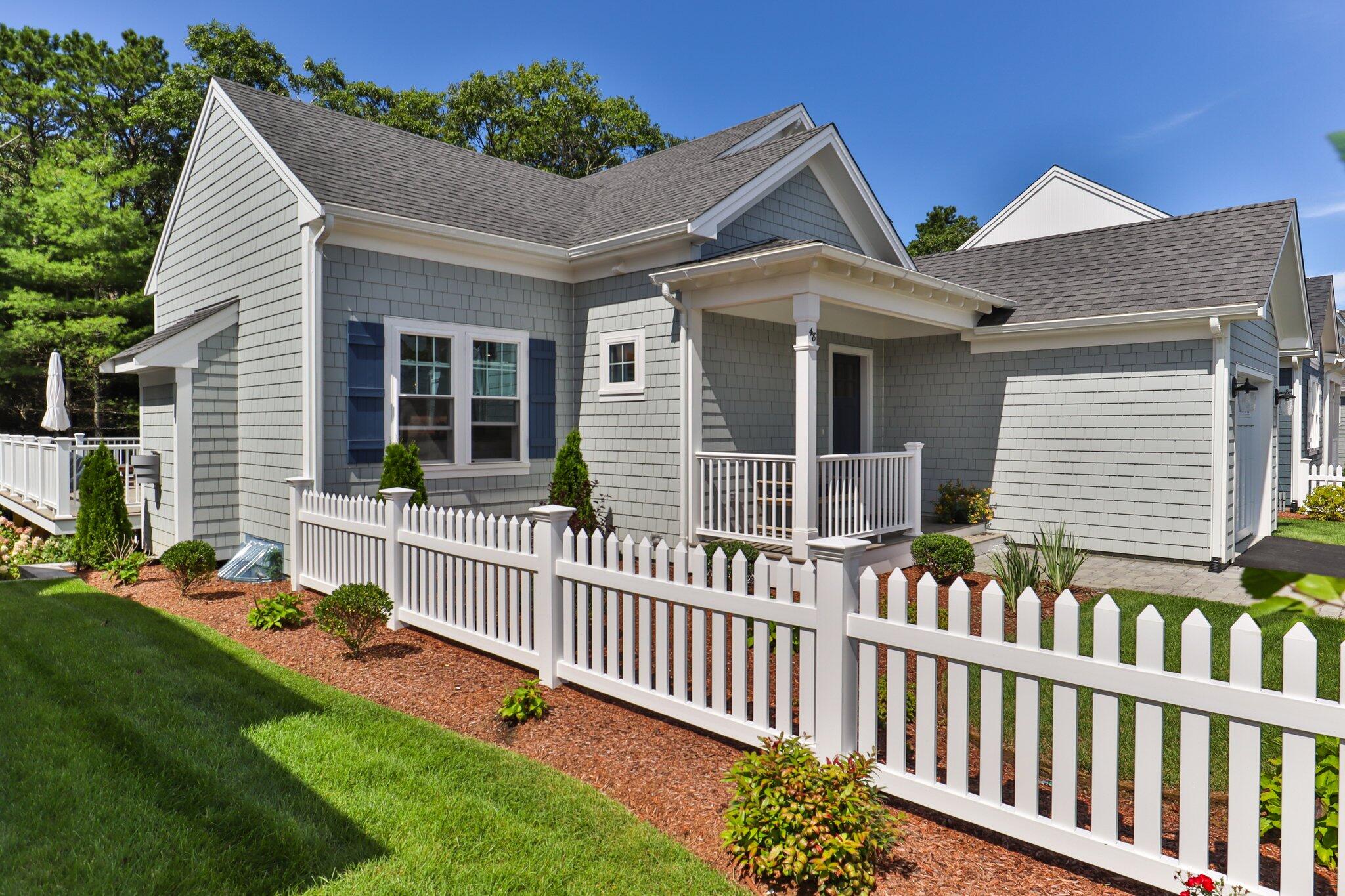 58 Cobblestone Circle Mashpee, MA 02649 - Photo 28 of 49 a front view of a house with a garden