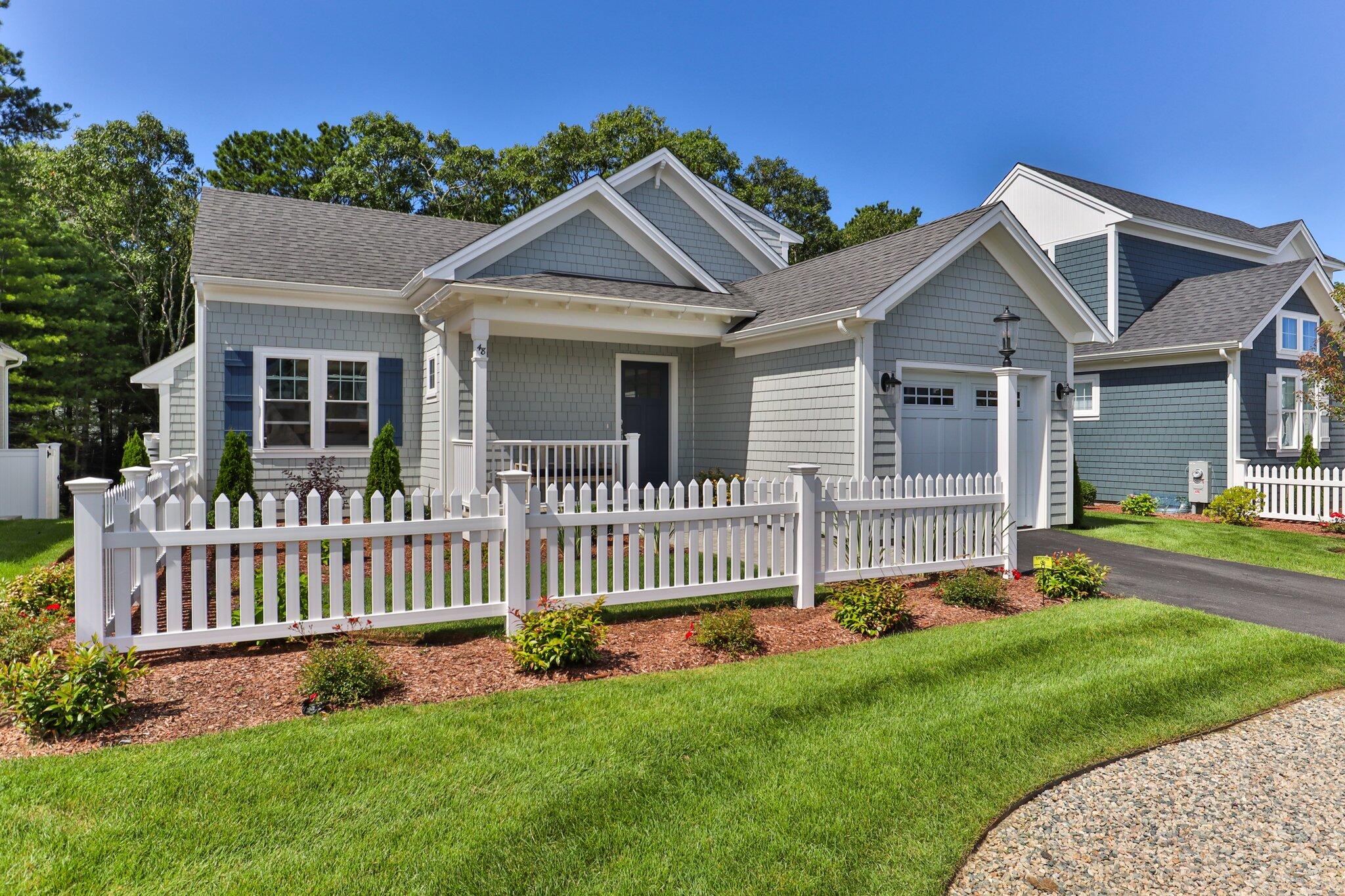 58 Cobblestone Circle Mashpee, MA 02649 - Photo 3 of 49 a front view of a house with a yard