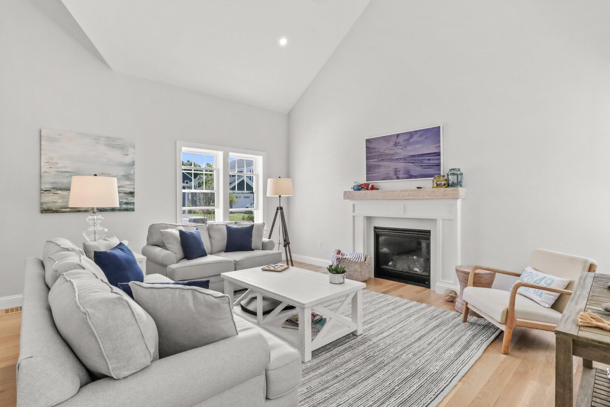 58 Cobblestone Circle Mashpee, MA 02649 - Photo 6 of 49 a living room with furniture and a fireplace
