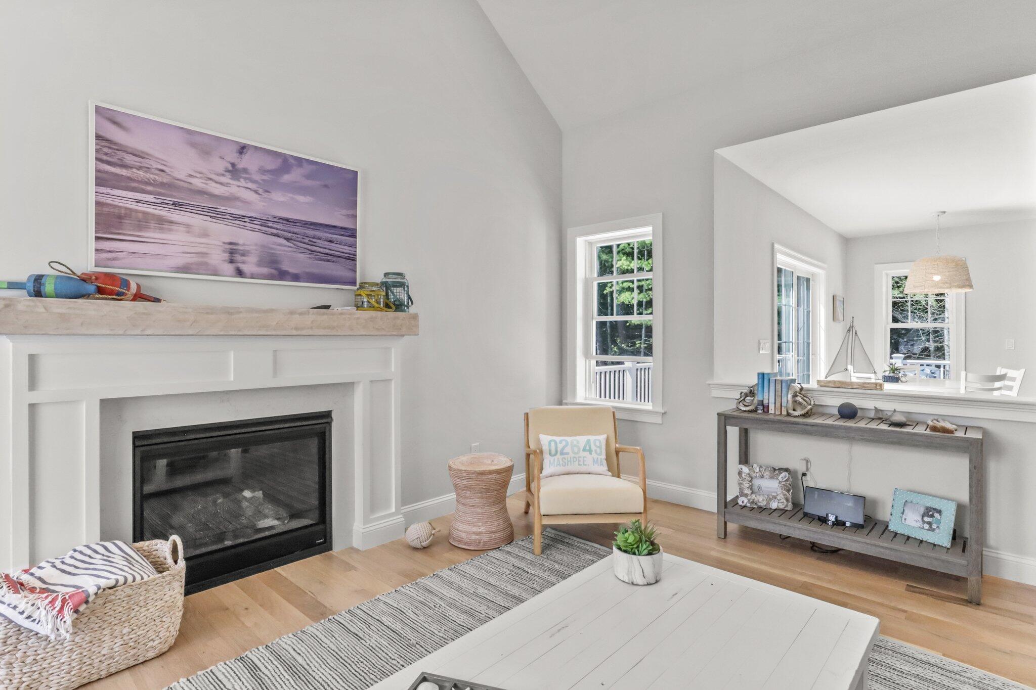 58 Cobblestone Circle Mashpee, MA 02649 - Photo 7 of 49 a living room with furniture and a fireplace