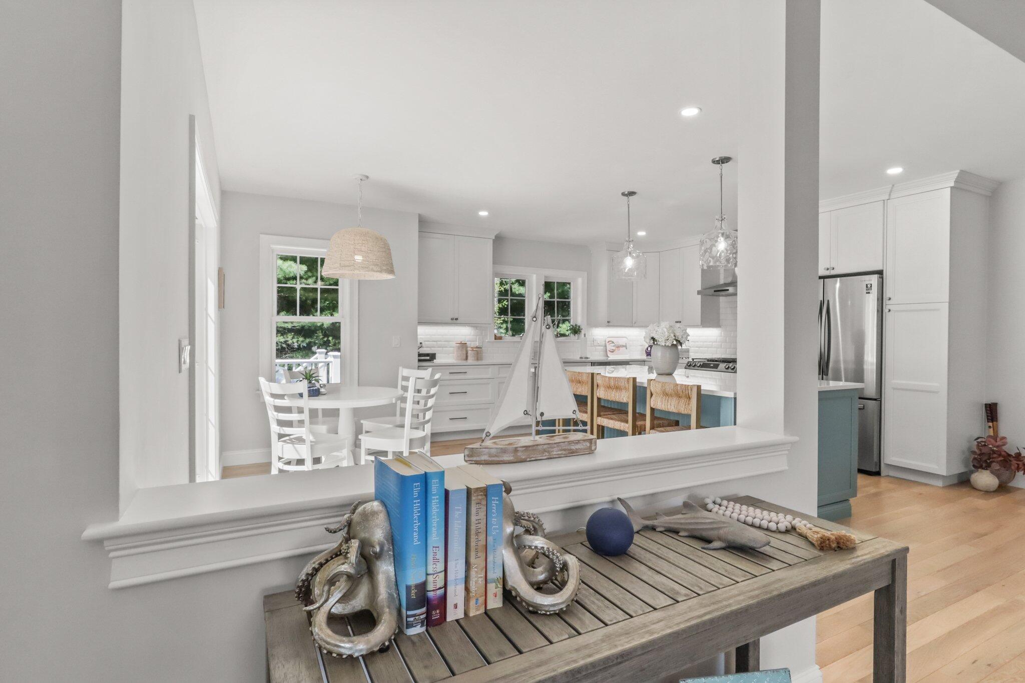 58 Cobblestone Circle Mashpee, MA 02649 - Photo 8 of 49 a kitchen with stainless steel appliances granite countertop a sink and a refrigerator