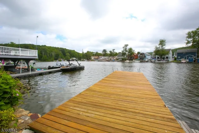 a kitchen with granite countertop a stove and a microwave