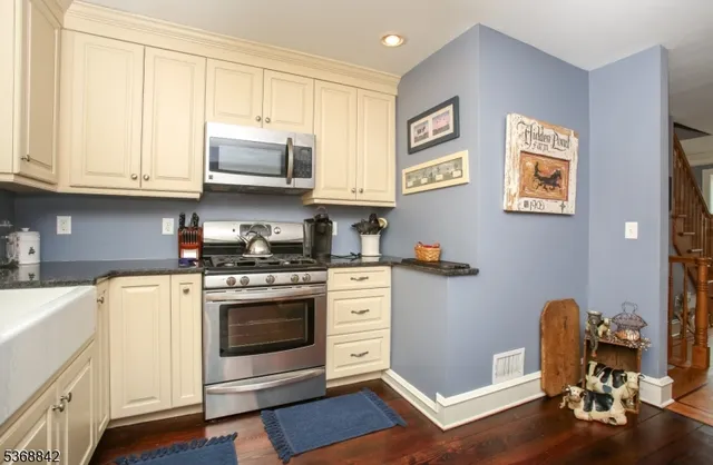a living room with furniture dining table and a flat screen tv