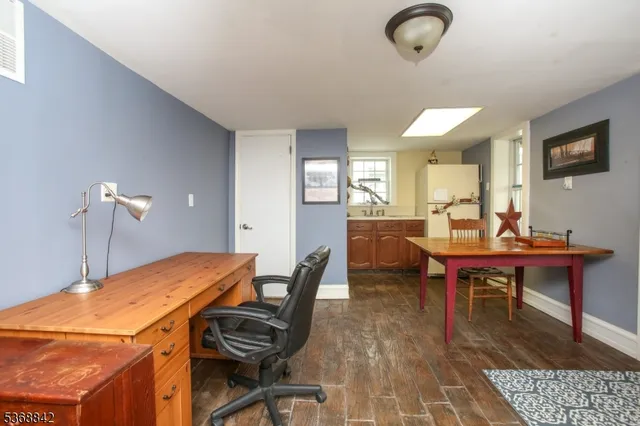 a white toilet sitting next to a bathroom sink and vanity