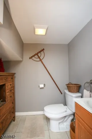 a room with a table chairs and wooden floor