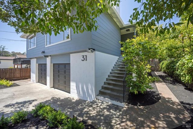 a view of a house with a yard and tree s