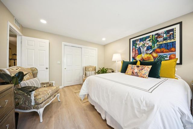 a bedroom with a bed and furniture