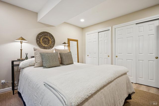 a bedroom with a bed and a closet