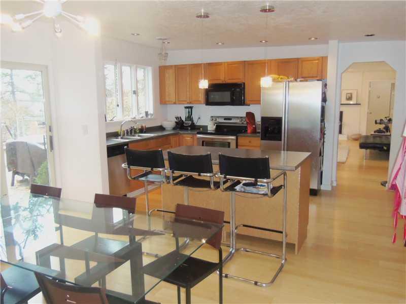 45 Chapel Ridge Road Fox Chapel, PA 15238 - Photo 2 of 18 Kitchen. The equipped, eat-in kitchen offers a Bamboo floor, recessed lighting, center island with additional seating, stainless steel gas range and stainless steel fridge with water and ice in the door. Windows and sliding glass door shown overlook the rear yard.