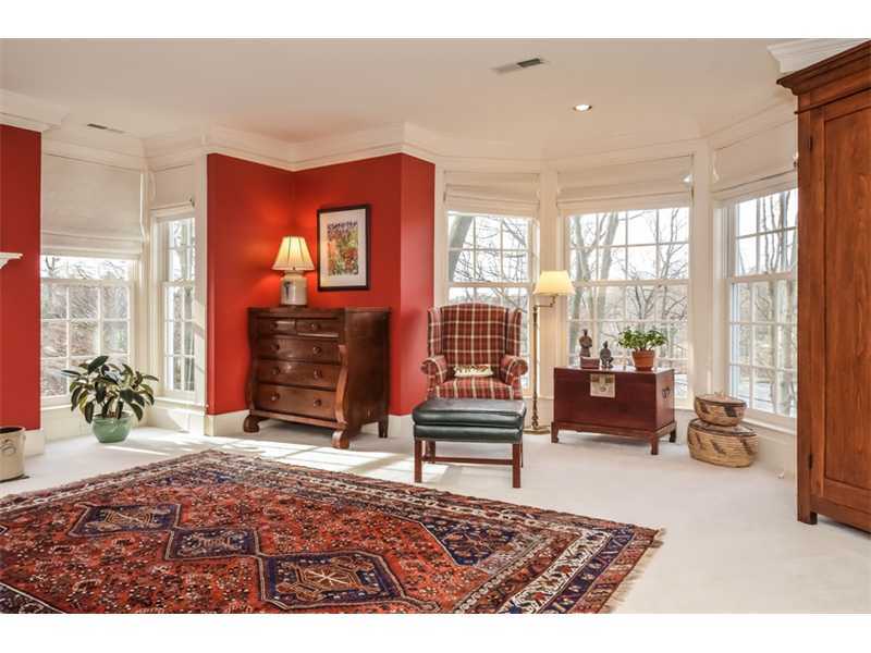 106 Goodwives River Road Darien, CT 06820 - Photo 14 of 24 a living room with furniture a dining table and a large window