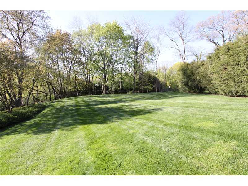 106 Goodwives River Road Darien, CT 06820 - Photo 18 of 24 a backyard of a house with lots of green space