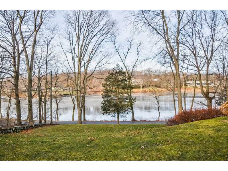 106 Goodwives River Road Darien, CT 06820 - Photo 3 of 24 a backyard of a house with lots of green space