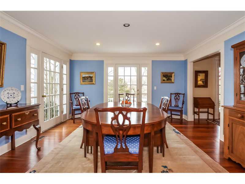 106 Goodwives River Road Darien, CT 06820 - Photo 8 of 24 a view of a dining room with furniture window and wooden floor