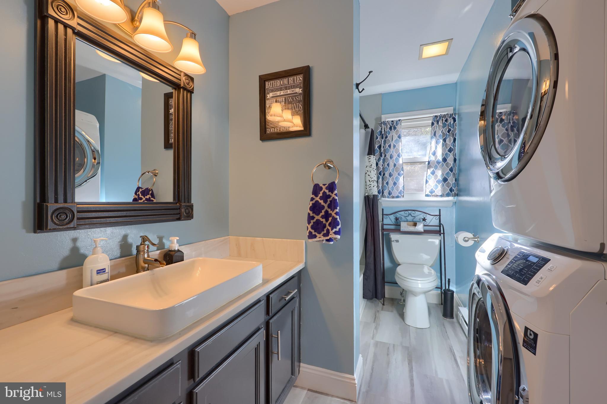 260 Valley Road Conestoga, PA 17516 - Photo 33 of 48 a bathroom with a toilet a sink and a mirror