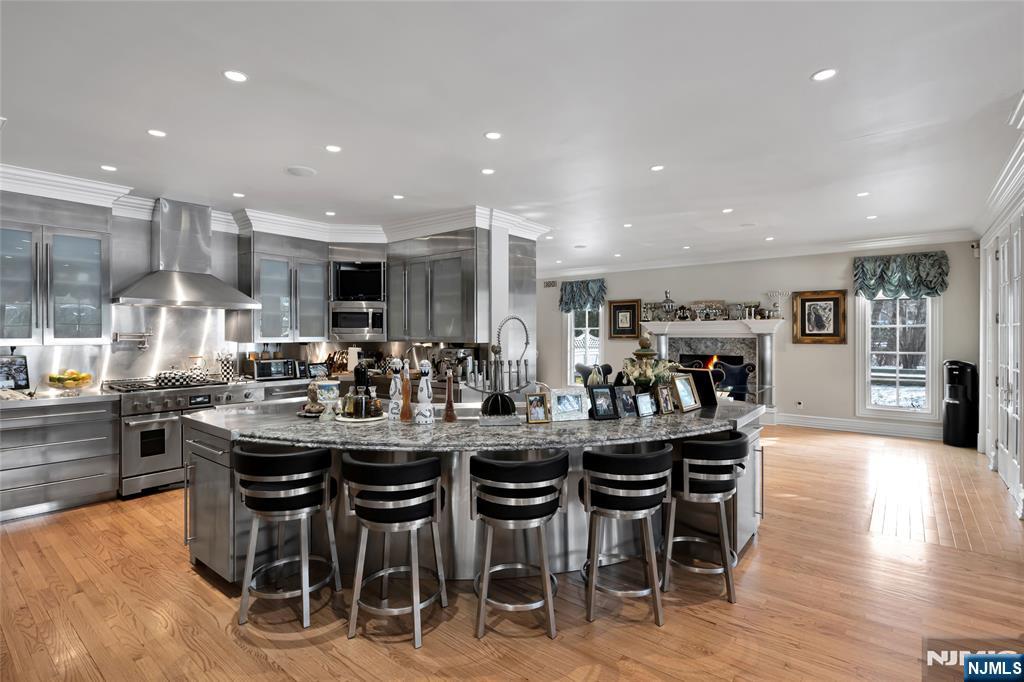 12 The Esplanade Alpine, NJ 07620 - Photo 12 of 41 a kitchen with lots of wooden furniture dining table and chairs
